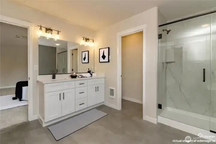 Huge primary bath with dual vanities and lots of counter and cupboard space Huge primary bath with dual vanities and lots of counter and cupboard space
