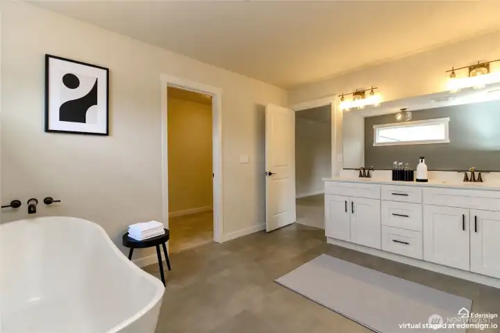 Huge primary bath with dual vanities and lots of counter and cupboard space Huge primary bath with dual vanities and lots of counter and cupboard space