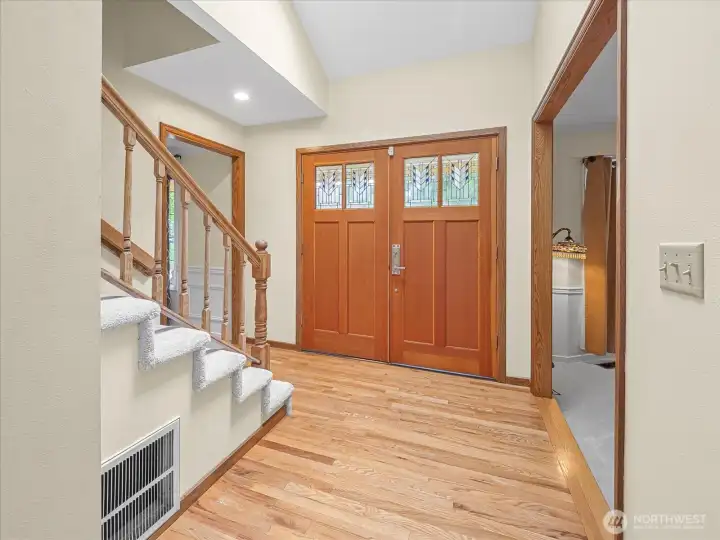 Gleaming custom double Fir doors with stained glass.