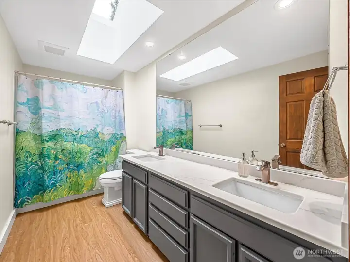 Shared bathroom, newer double sinks.