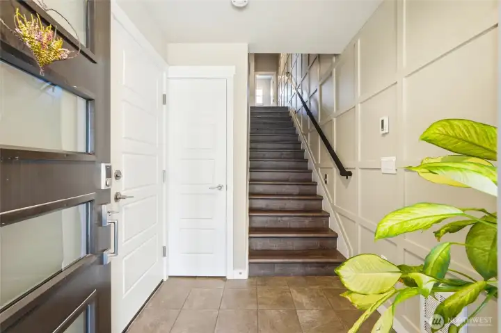 The inviting entry is enhanced with elegant board-and-batten detailing for a refined welcome. The inviting entry is enhanced with elegant board-and-batten detailing for a refined welcome.