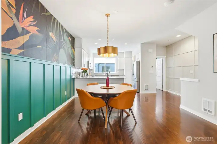 The dining area features an upgraded light fixture and a striking wallpaper, an eye-catching focal point full of personality. The dining area features an upgraded light fixture and a striking wallpaper, an eye-catching focal point full of personality.