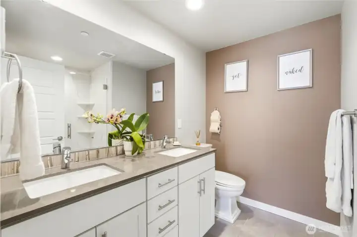 Indulge in the spa-like primary bathroom with heated floors. Indulge in the spa-like primary bathroom with heated floors.