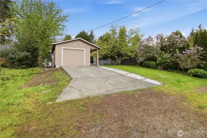 Exceptional curb appeal welcomes you home with mature landscaping and a stunning flowering tree that blooms vibrant pink each spring. Exceptional curb appeal welcomes you home with mature landscaping and a stunning flowering tree that blooms vibrant pink each spring.