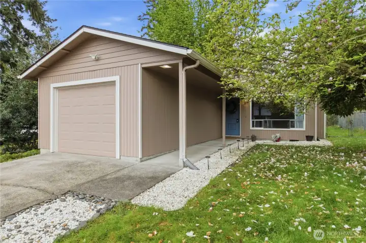 An attached one-car garage offers everyday convenience along with additional storage options. An attached one-car garage offers everyday convenience along with additional storage options.