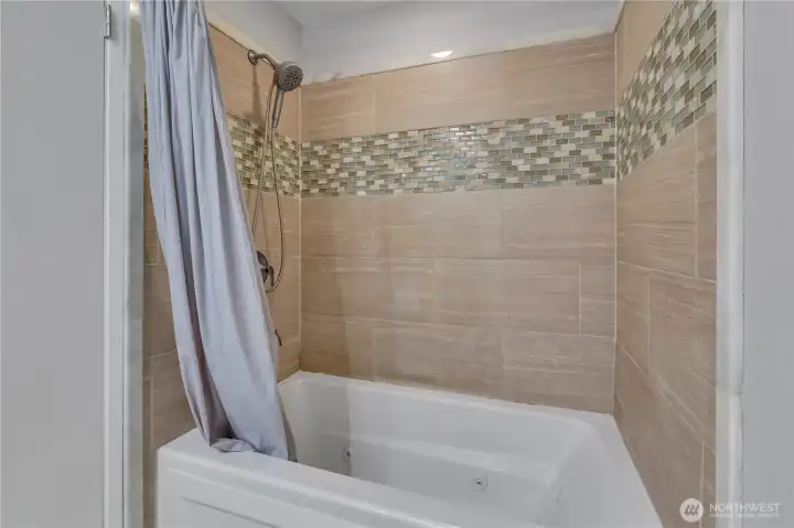 Relax after a long day in the luxurious jetted soaking tub located in the beautifully updated hall bathroom. Relax after a long day in the luxurious jetted soaking tub located in the beautifully updated hall bathroom.