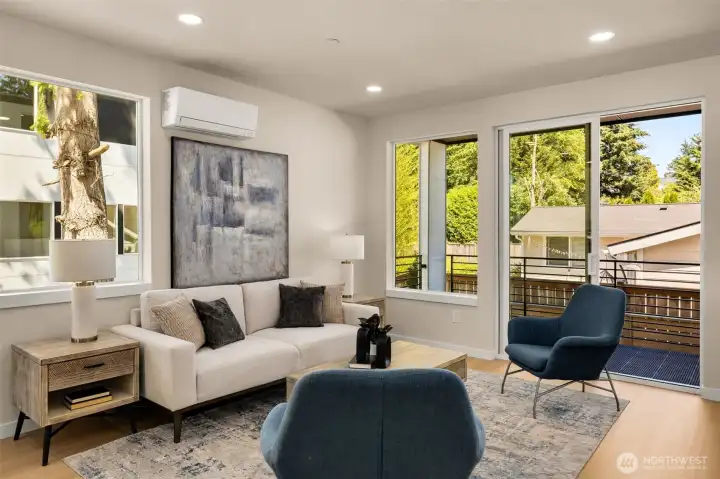 Bright and airy open-concept living room bathed in natural light, showcasing sleek contemporary finishes (these are of model home, similar finishes and layout) Bright and airy open-concept living room bathed in natural light, showcasing sleek contemporary finishes (these are of model home, similar finishes and layout)