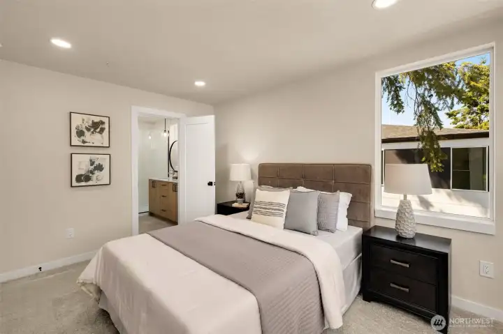 Generous primary bedroom suite complete with expansive windows and a bright, airy feel (these are of model home, similar finishes and layout) Generous primary bedroom suite complete with expansive windows and a bright, airy feel (these are of model home, similar finishes and layout)