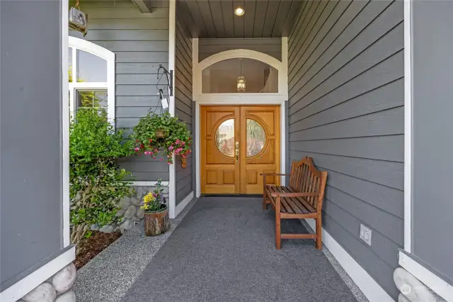 Large & private front porch with custom double doors.