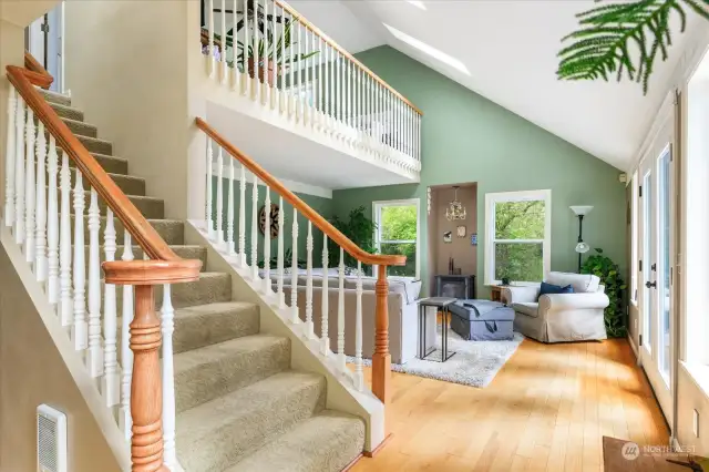 Stairs up located between living room and dining room.