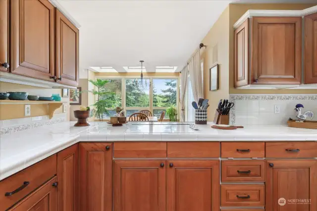 Kitchen has beautiful cherry wood cabinets.