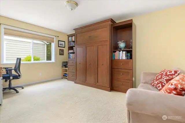 Main level bedroom showing Murphy bed closed.