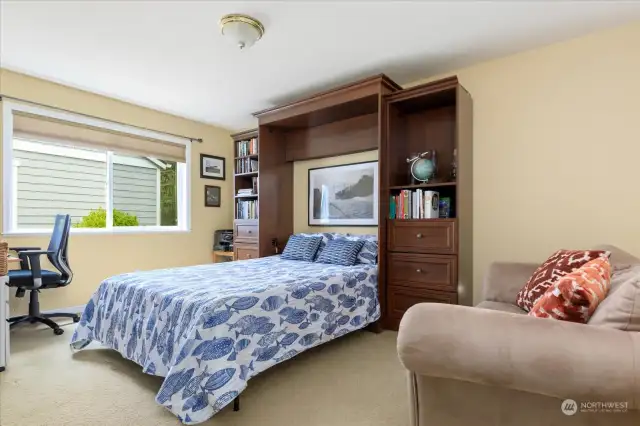 Main level bedroom showing Murphy bed open.