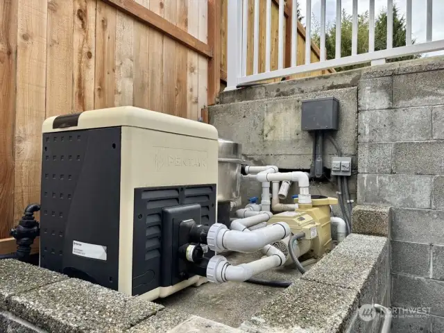 Newly installed swimming pool gas water heater and filtration system, allowing for year-round pool enjoyment and extending the swimming season.