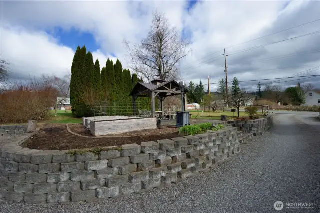 Gazebo with raised beds have auto watering system throughout.