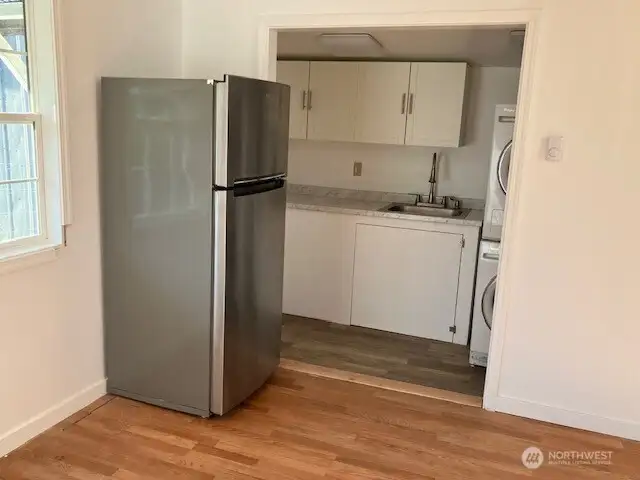 DADU kitchenette with stackable W/D, fridge & new stove & convection oven. Also has its own ' x ' insulated storage shed.
