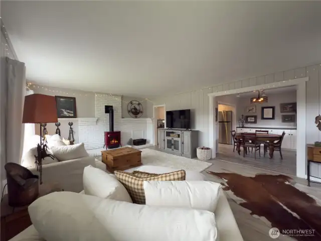 Large, bright living room with new gas heat stove