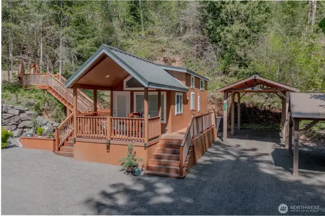 Charming 1-bed, 1-bath home with a spacious wrap-around deck overlooking a beautifully landscaped, oversized lot with sweeping territorial views
