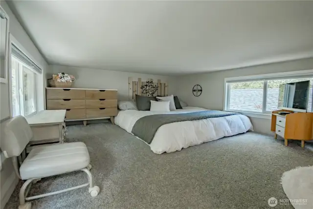 The generous 11x15 loft serves as a cozy and private master bedroom retreat
