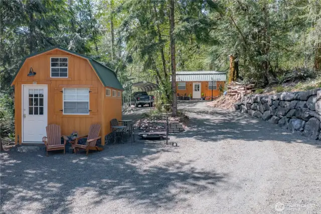 The driveway extends alongside the impressive, well-constructed rock wall