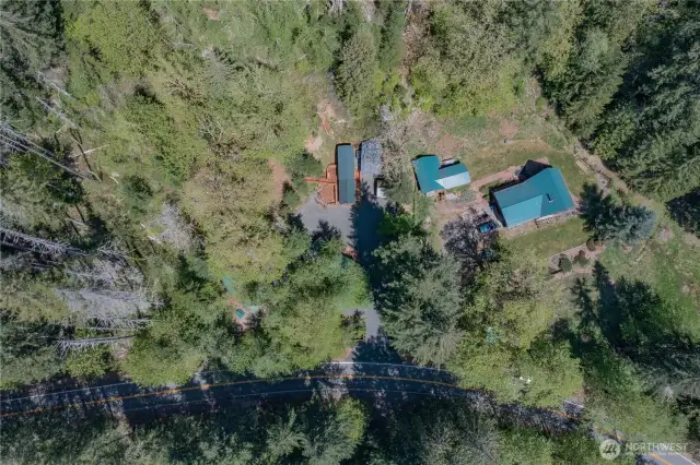 Bird’s-eye view showcases the home and grounds in all their peaceful, natural charm