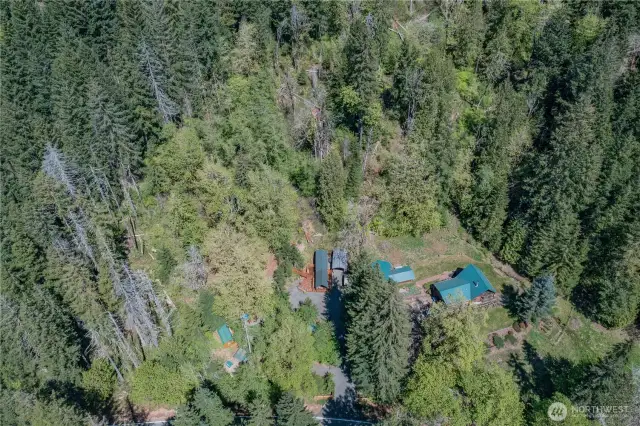Bird’s-eye view showcases the home and grounds in all their peaceful, natural charm