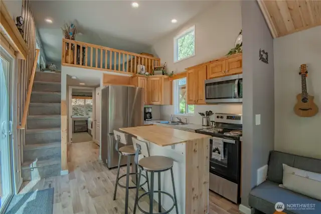 Enjoy a full kitchen with plenty of counter space, making meal prep a breeze in this charming home.