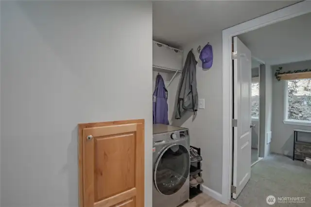 Handy washer-dryer combo with a small utility area just off the bathroom — everything you need within reach