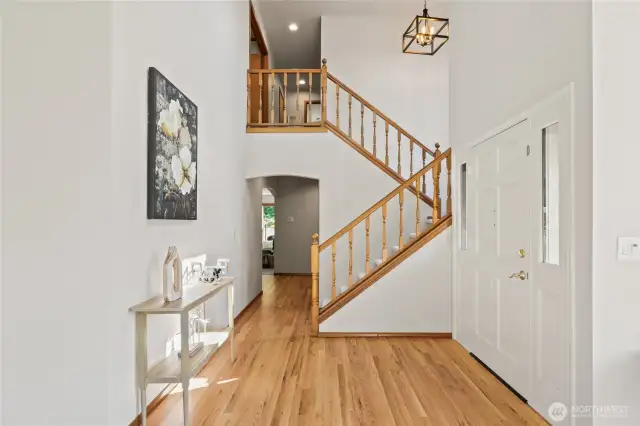 Refinished hardwoods gleam! 2 story foyer with new light.