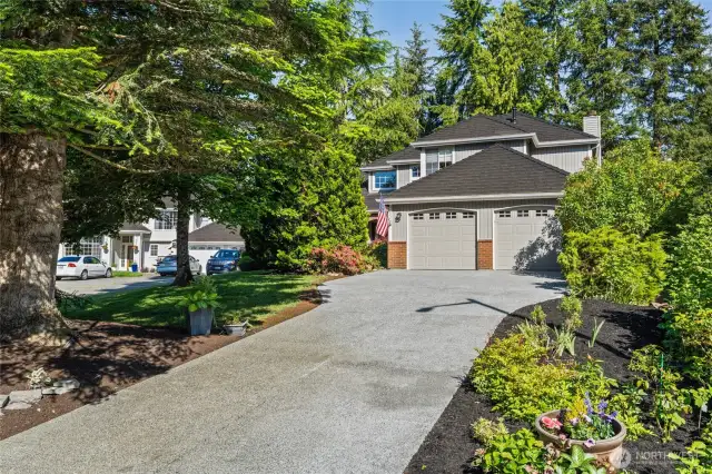 This welcoming brand new driveway invites you to enter.