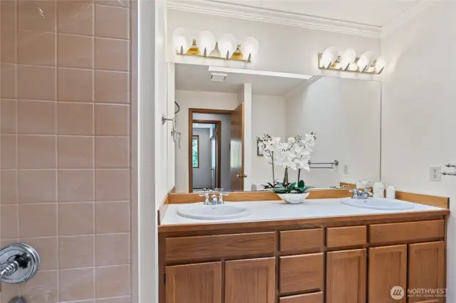 Upstairs full hall bathroom with double sinks.