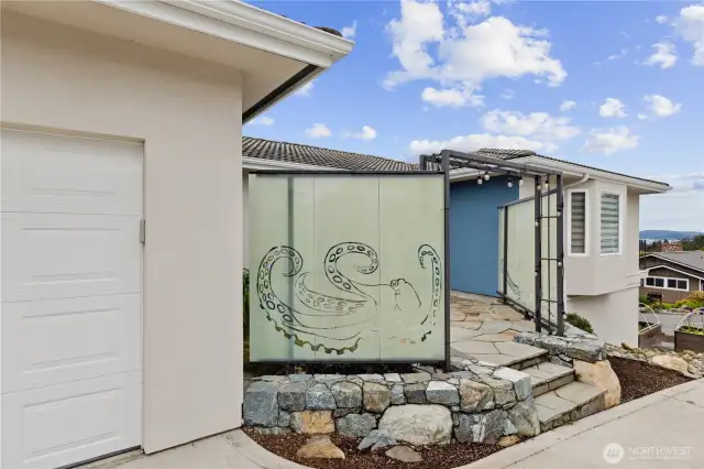 Custom designed glass panel entry for privacy and unique flair sets this home apart from all the others.