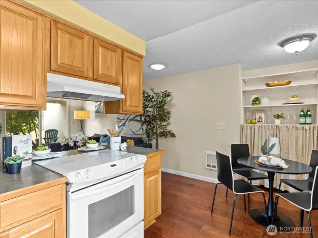 Galley-style, yet very open eat-in kitchen opens-up to living room.