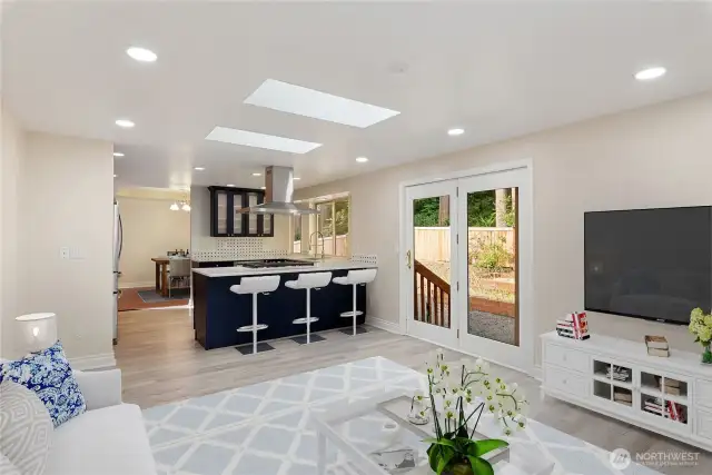 Alt view of family room with eat in kitchen space available. French doors to the outside. Virtually staged