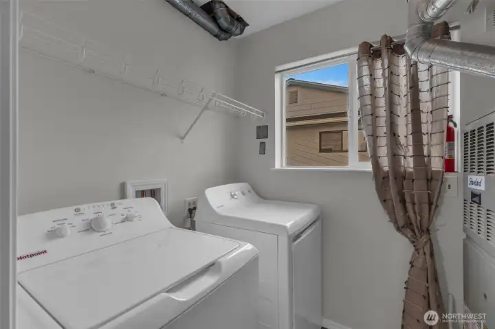 New washer and dryer in the laundry room.