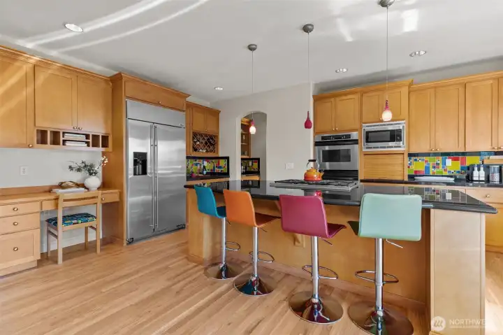 Chef-inspired kitchen with oversized island, solid wood cabinetry, and premium appliances—ideal for culinary creativity.