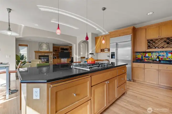 Central kitchen island offering ample prep space and seating—perfect for entertaining or casual meals.