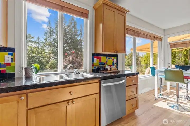 Kitchen sink overlooking the backyard, blending indoor comfort with serene outdoor views.
