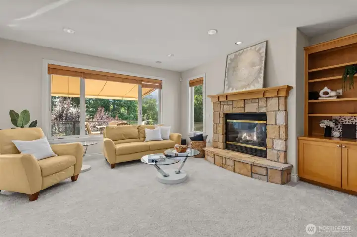 Spacious family room with fireplace and built-ins, offering a warm and inviting gathering space