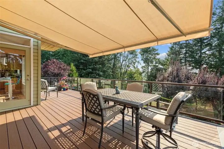 Expansive deck with retractable awning—perfect for outdoor dining, entertaining, and summer evenings.