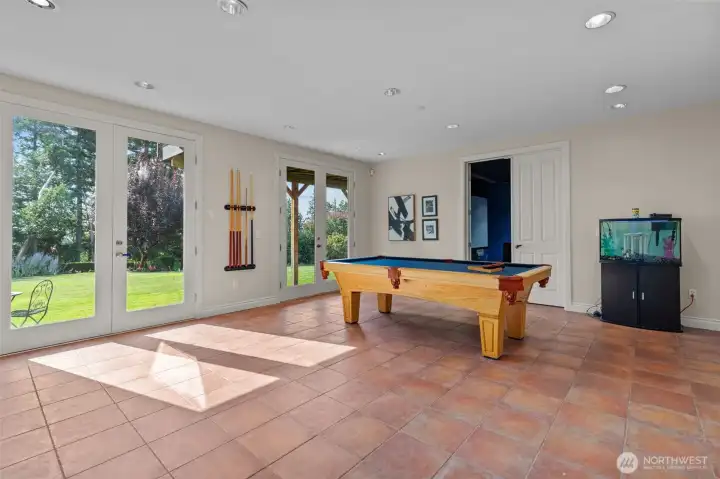 Recreation or game room with patio access, perfect for entertaining or casual gatherings.