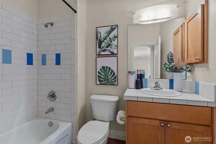 Full bathroom with modern tile surround and clean, classic finishes.