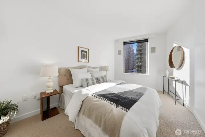 The primary bedroom is exceptionally spacious, providing ample room for personal decor ideas, and includes a large walk-in closet.