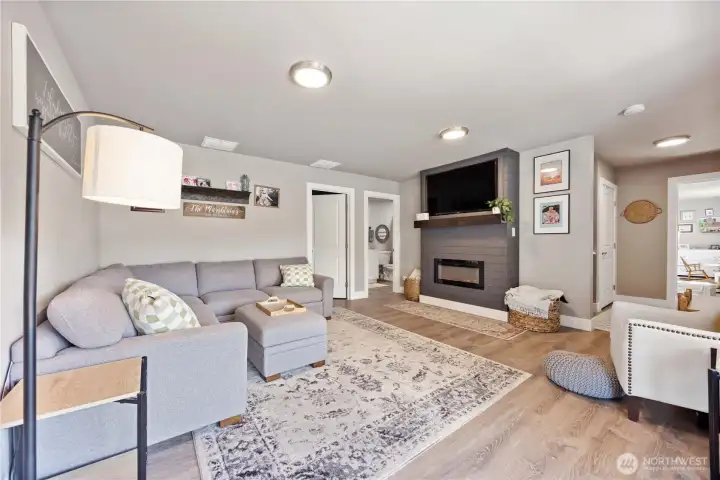View of daylight basement family room with fire place