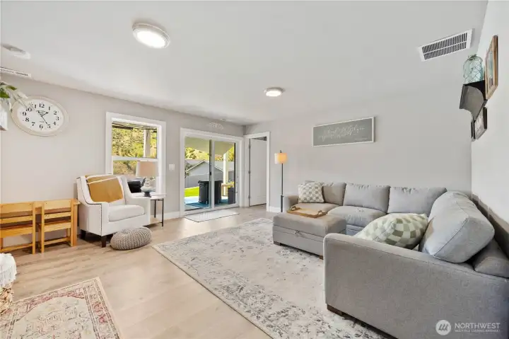 View of daylight basement family room with fire place