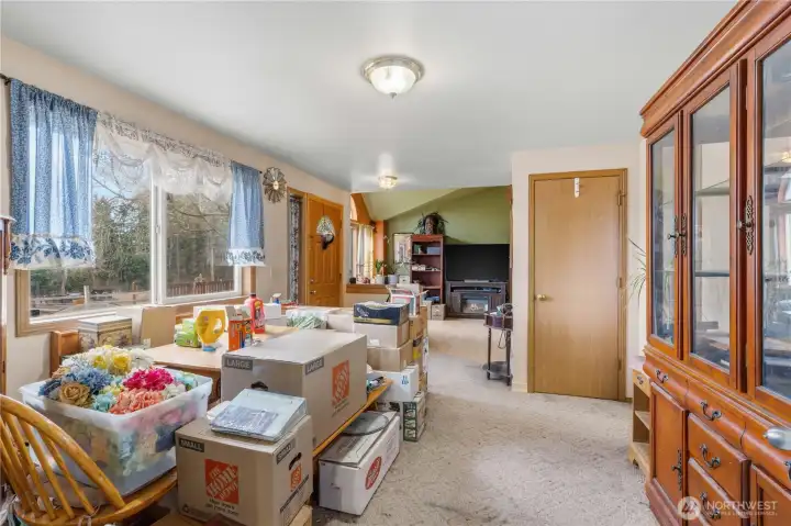 Dining Room facing Entry and Living Room (Family is packing, excuse the mess!) Coat closet shown.