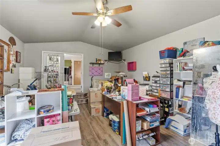 Family Room - used as a craft room right now. Laminate Floors and Ceiling Fan.