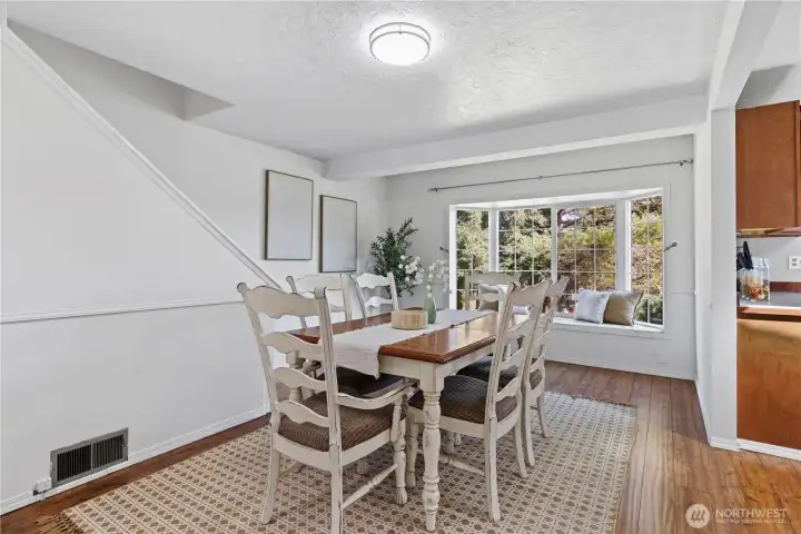 Dining room features beautiful bay window with bench seating and territoral views Dining room features beautiful bay window with bench seating and territoral views
