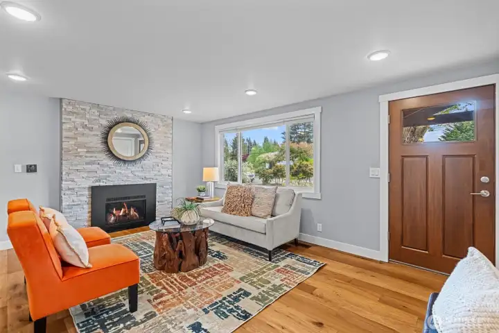 Living room with fireplace to cozy up by and unwind at the end of the day.