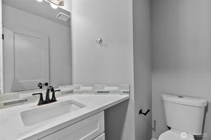 1/2 bath by laundry & entrance